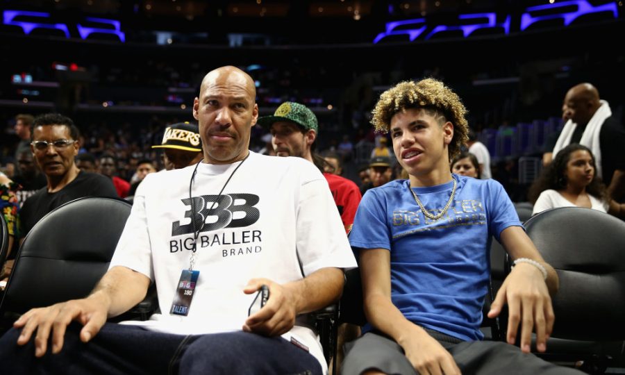 LOS ANGELES, CA - AUGUST 13:  (L-R) Lavar Ball and LaMelo Ball look on from the audience during week eight of the BIG3 three on three basketball league at Staples Center on August 13, 2017 in Los Angeles, California.  (Photo by Sean M. Haffey/Getty Images)