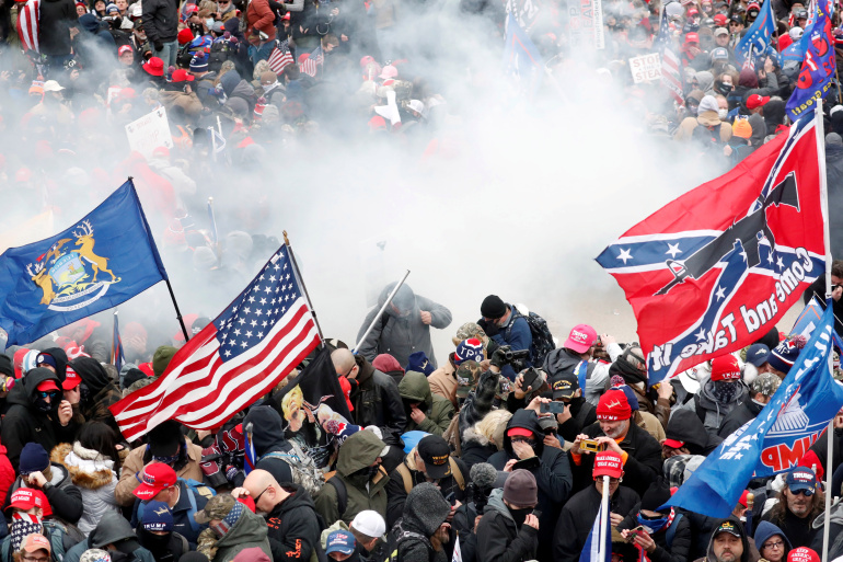 Tear gas is released into a crowd of protesters during clashes with Capitol police at a rally to contest the certification of the 2020 U.S. presidential election results by the U.S. Congress, at the U.S. Capitol Building in Washington, U.S, January 6, 2021. REUTERS/Shannon Stapleton/File Photo
