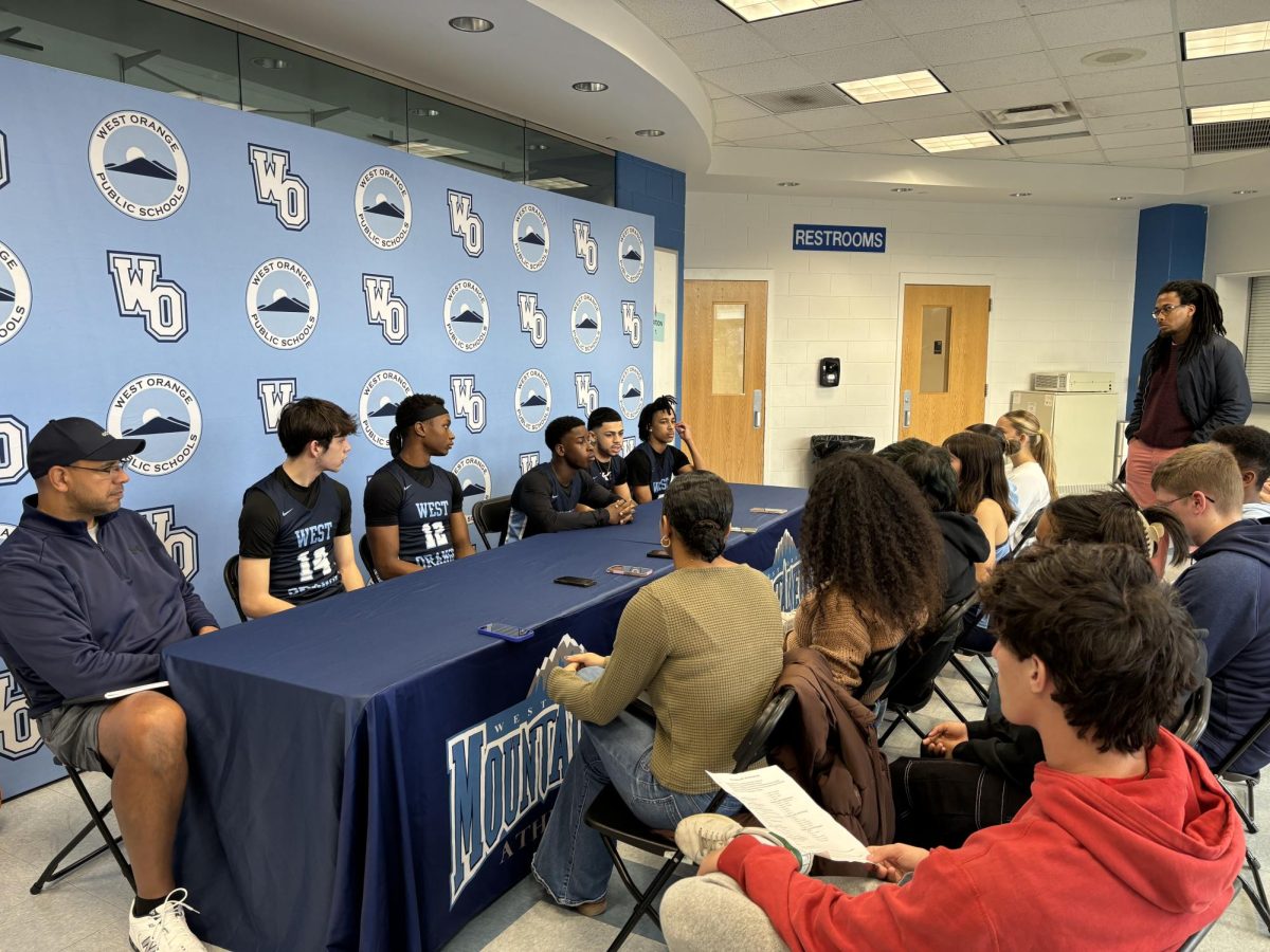 The Pioneer interviews the boys basketball team and coach in the press conference. 